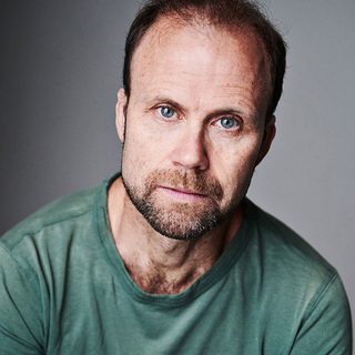 Headshot of Simon Scardifield looking directly at the camera.