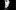 A man stands in the shadows