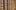 A close up of the wooden bars that line a gallery of a stage