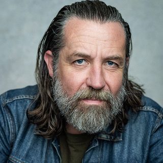 Headshot of Ferdy Roberts looking directly at the camera.