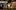 A strip of film photographs showing Her Majesty The Queen attending the opening of the Globe Theatre, including: Her Majesty The Queen travelling by boat with a guard of Royal attendants; a close-up of Her Majesty The Queen smiling.
