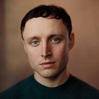 Headshot of Ned Costello looking directly at the camera.