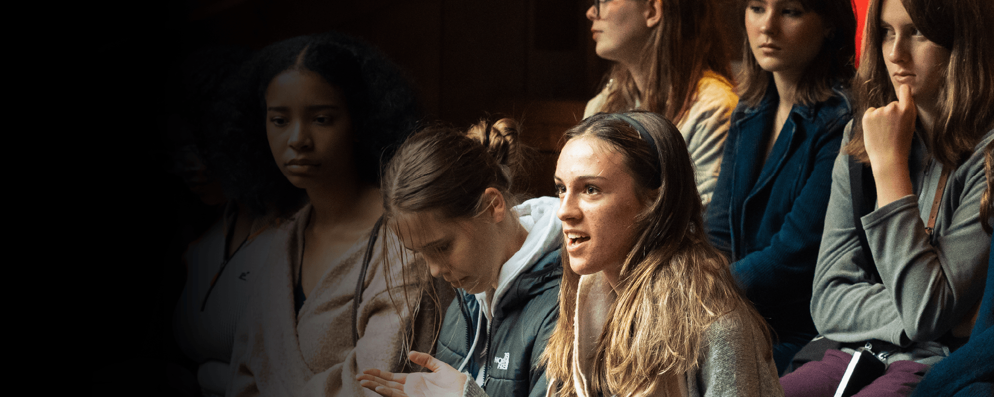 Children sat in the Globe Theatre stalls.