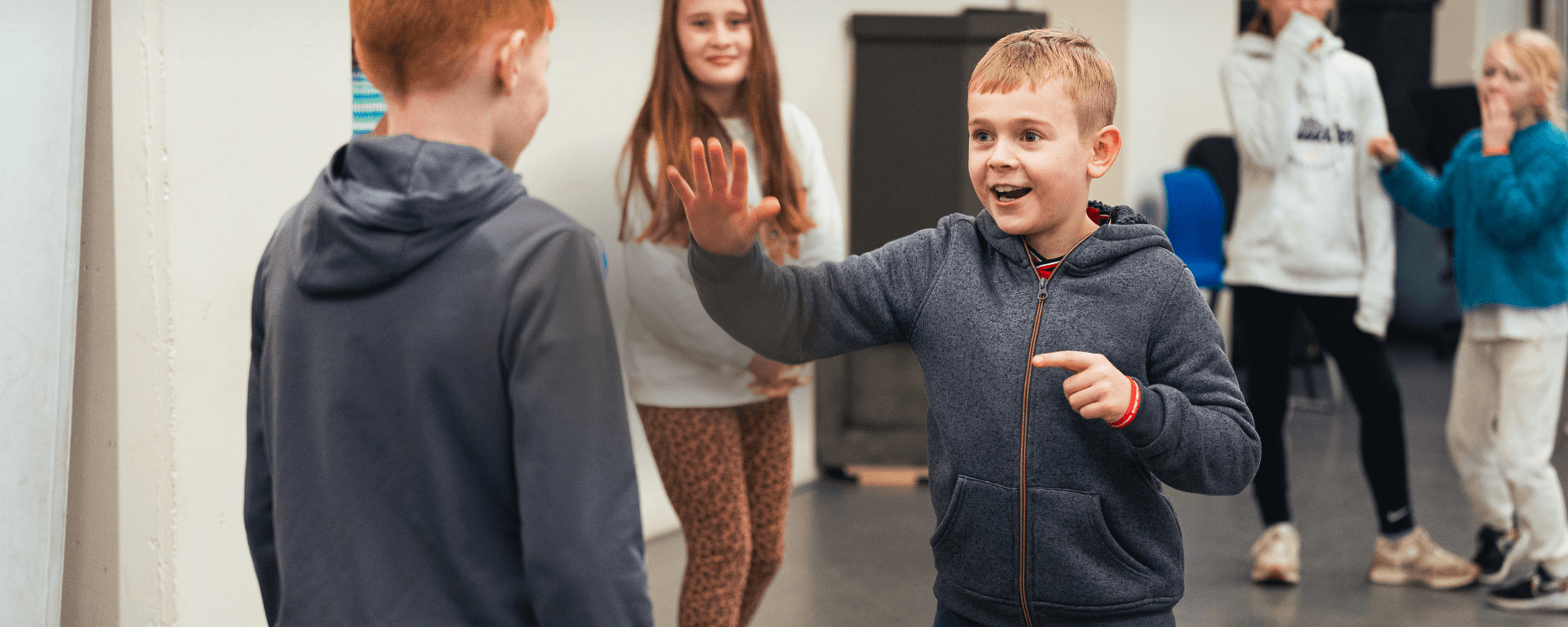 Happy children in a rehearsal room.