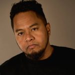 Faizal Abdullah wearing a black t-shirt and looking directly at the camera.