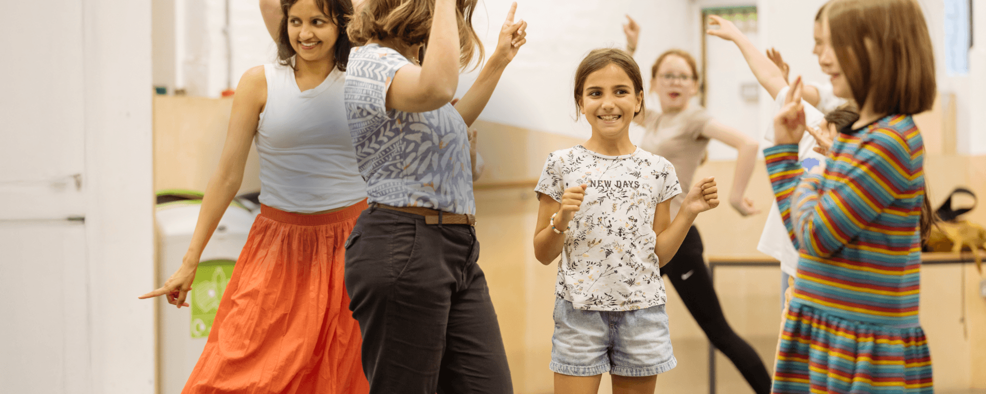 Children and adults engaging in an interactive family workshop. 'A World Elsewhere Family Workshop 9-11 years, for the Deaf and BSL users'.