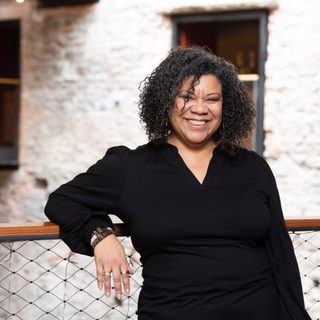 Headshot of Nancy Medina, who is smiling and looking at the camera