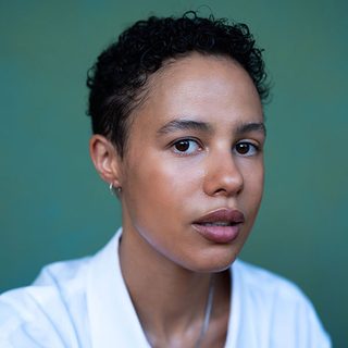 Headshot of Mel Lowe looking directly at the camera.