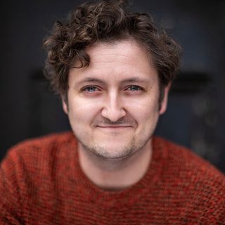 Headshot of Michael Grady-Hall looking directly at the camera.