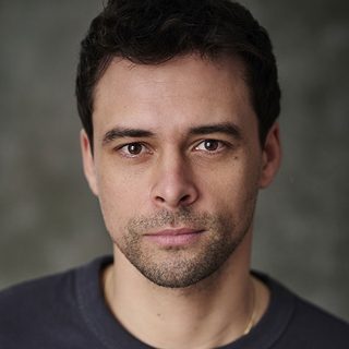 Headshot of Adam Long looking directly at the camera.