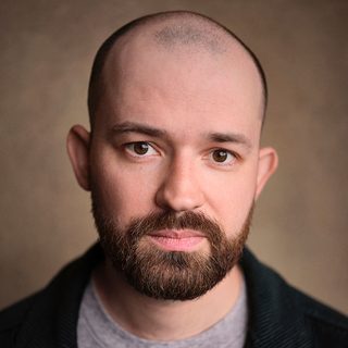 Headshot of Kaffe Keating looking directly at the camera.