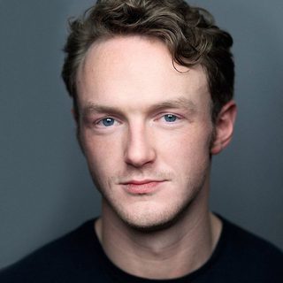 Headshot of Joshua Hill looking directly at the camera.