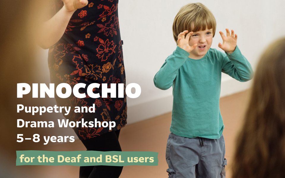 A child holding their hands up as they take part in a workshop. Pinocchio: Puppetry and Drama Workshop for the Deaf and BSL users. 5-8 years.