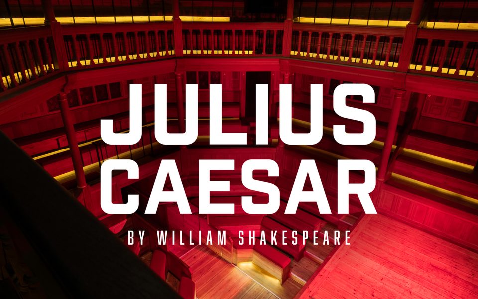 Julius Caesar. The interior of a wooden playhouse bathed in a red light.