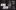 King John by William Shakespeare. Ripped and rumpled graphic posters of medieval Kings are stuck up on black, wooden-panelled doors covered in intricate gold lining.