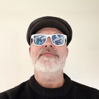 Rob Biddulph wearing a cap and sunglasses.