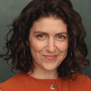 Celia Cruwys-Finnigan smiling directly at the camera.